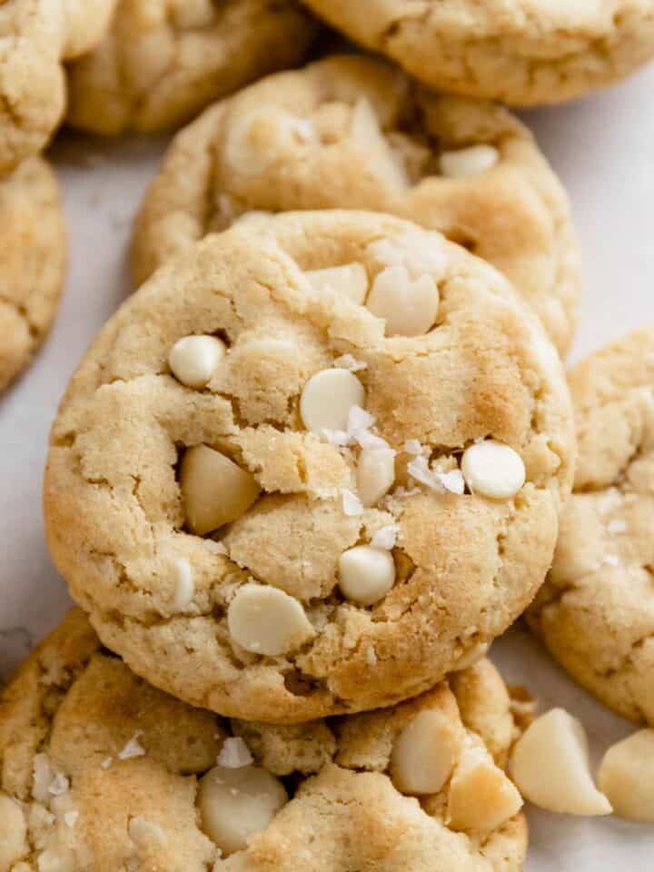 a stack of white chocolate macadamia nut cookies