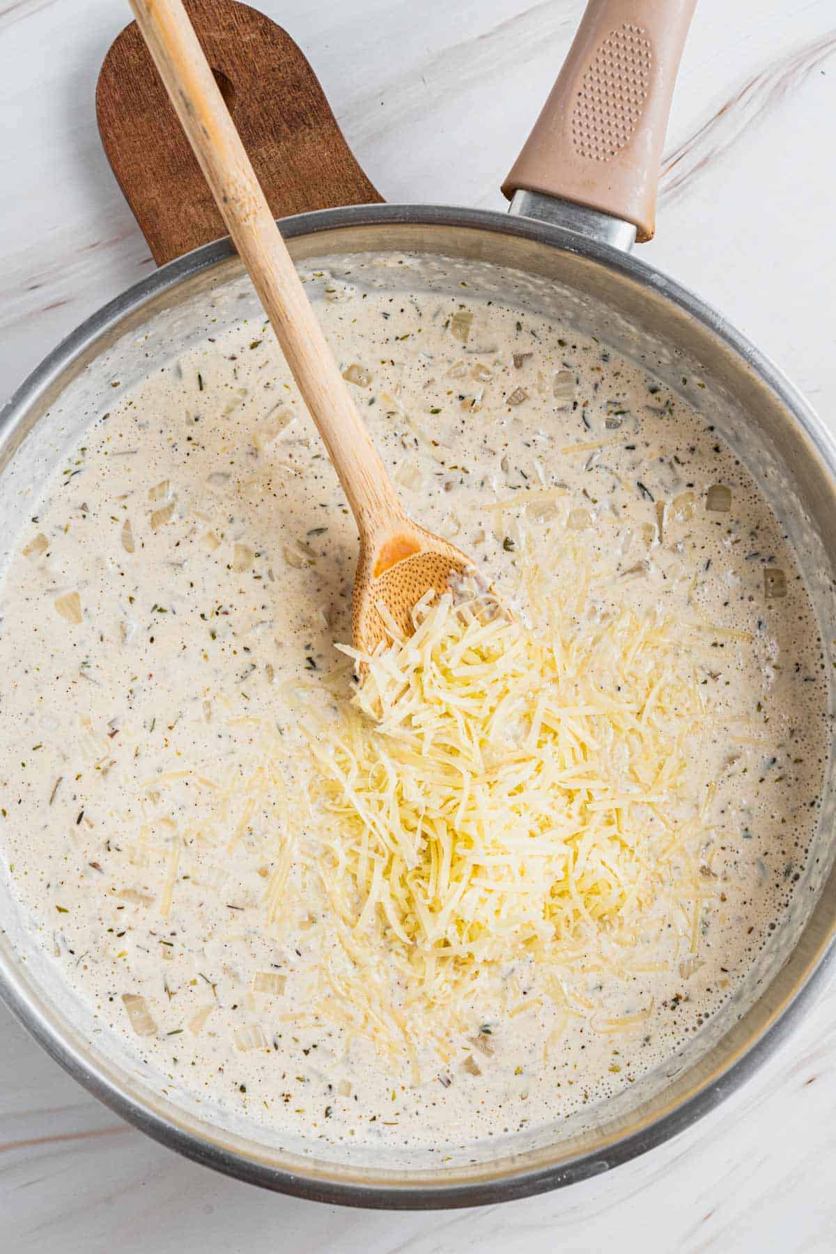 parmesan cheese mixed in white sauce.