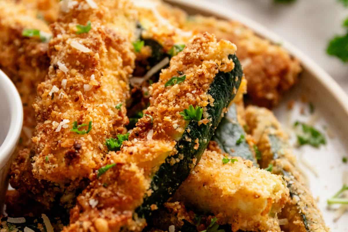 almond flour and parmesan coated zucchini fries on a plate.