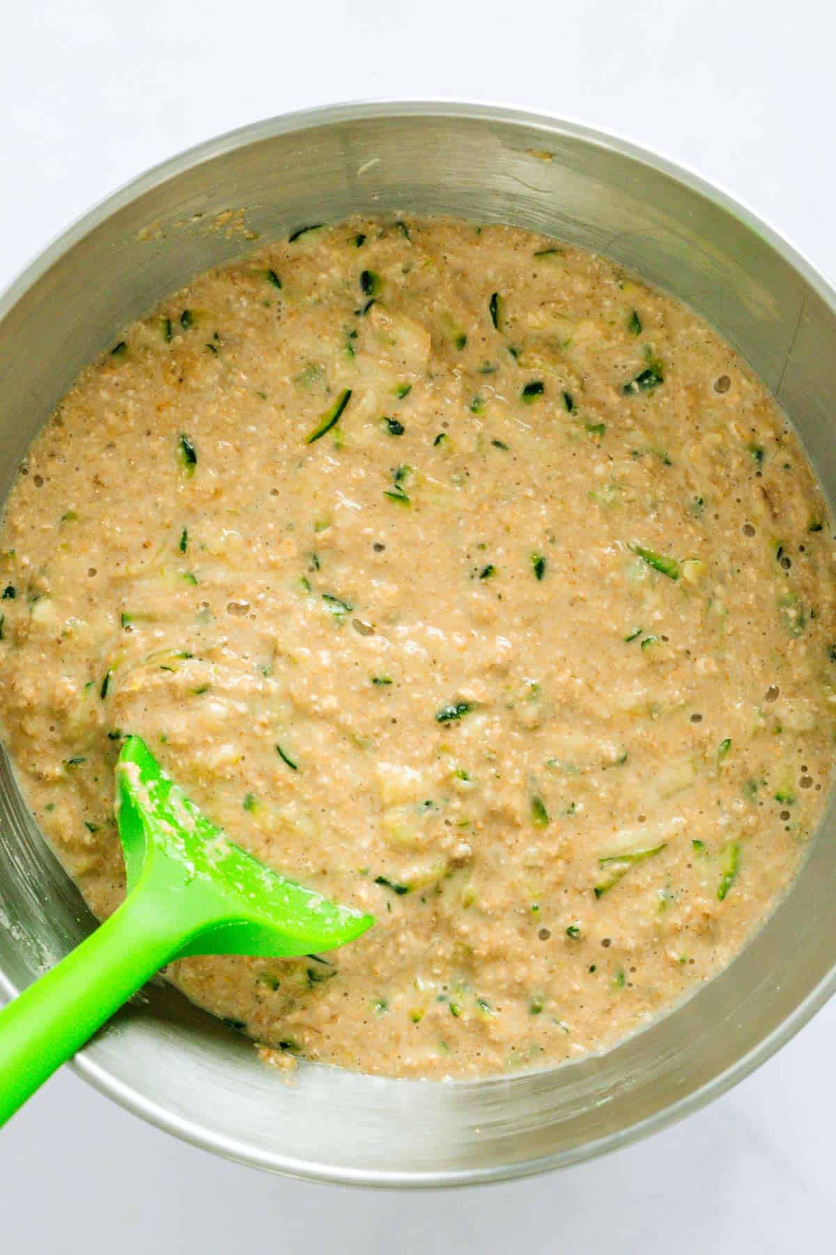 zucchini muffin batter in a bowl.